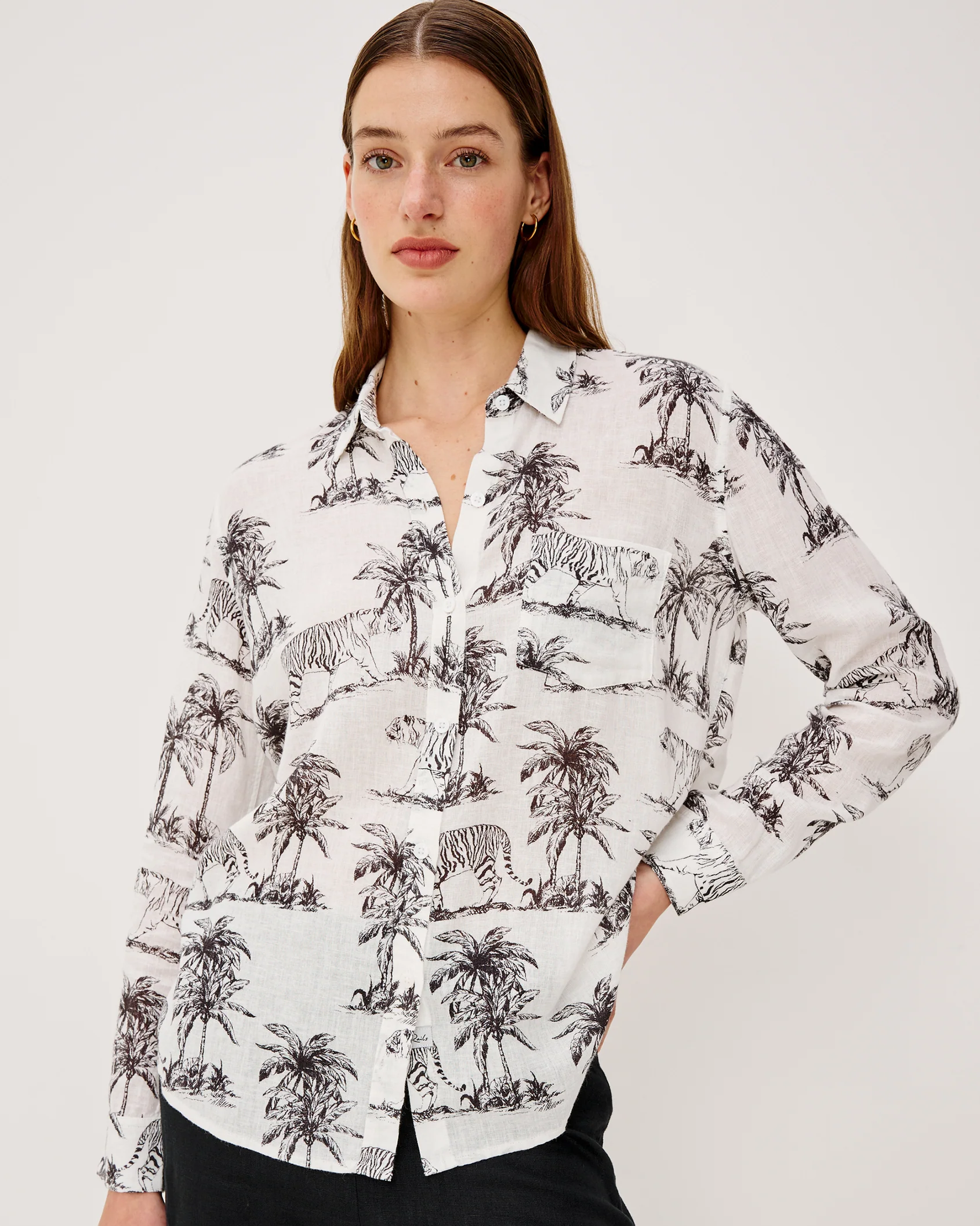 Woman wearing Charli - Ivory Bengal shirt in white linen blend with animal and palm prints by RAILS