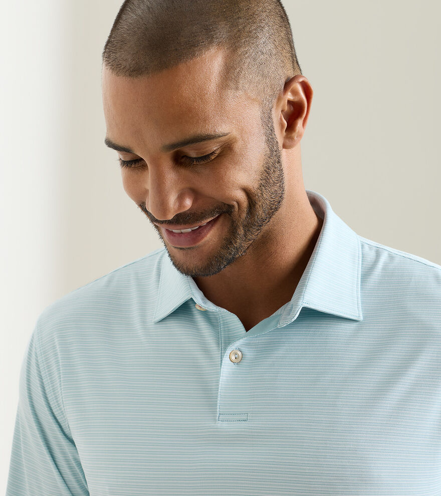 Featherweight Trading Stripe Performance Polo in light blue with moisture wicking and UPF 50+ protection