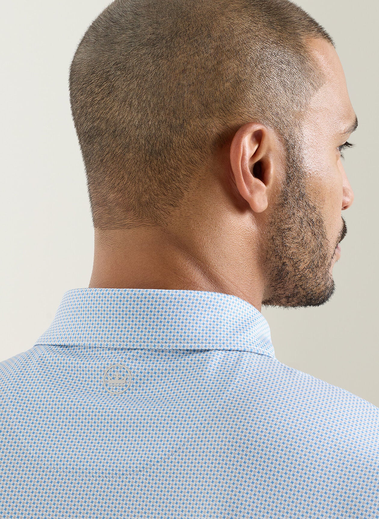 Phoenix Performance Jersey Polo in light blue geometric print with moisture wicking by PETER MILLAR
