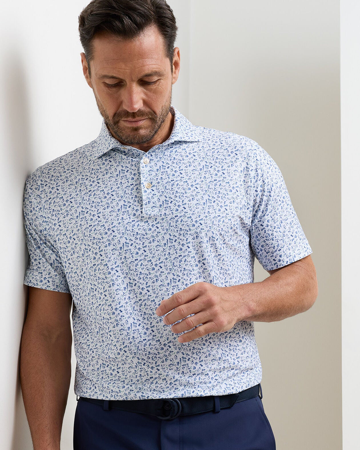 Wilkins Performance Jersey Polo in white floral with moisture wicking and UPF 50+ protection
