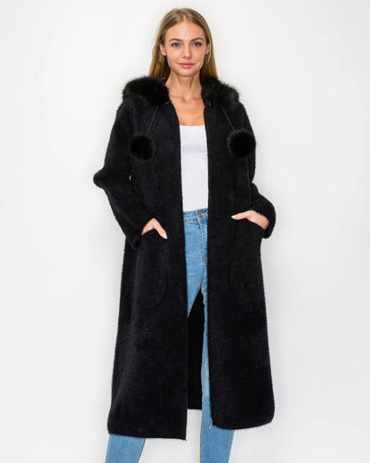Suraya Knitted Brushed Coat in black with faux fur hood and pom-poms by JOH APPAREL