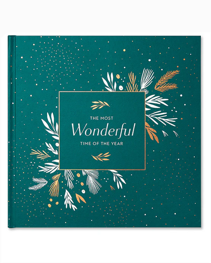 The Most Wonderful Time Of The Year book with elegant green cover featuring gold and white botanical illustrations and festive accents, personally curated in Fredericksburg, Texas.
