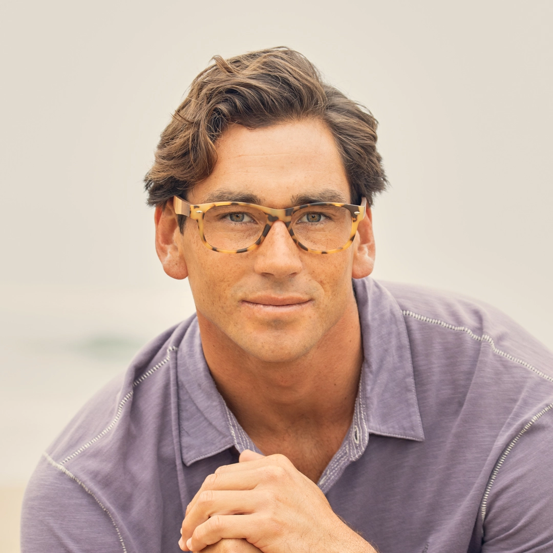 River eyeglasses on model, matte tort frame with multi-wood temple accents