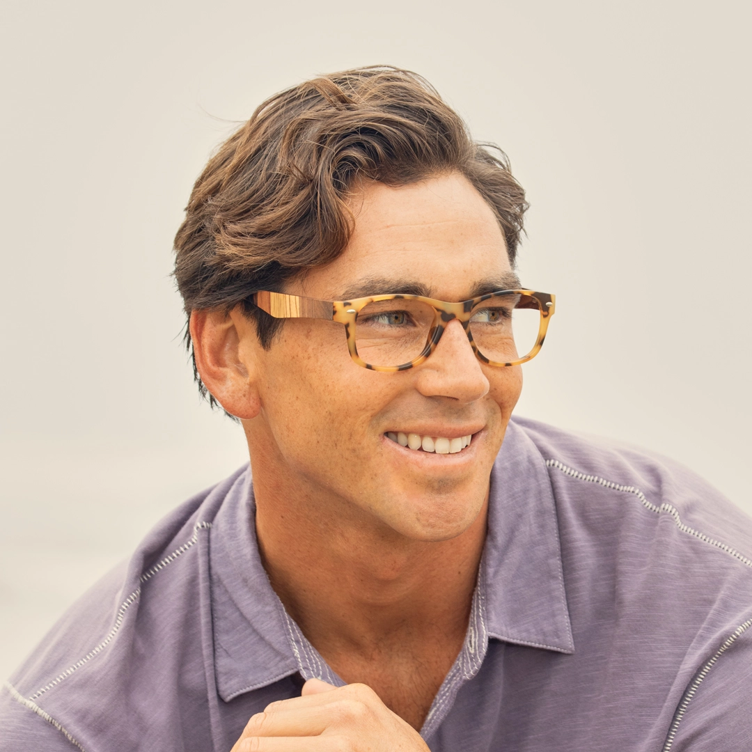 River eyeglasses on model, matte tort and multi-wood temple sides