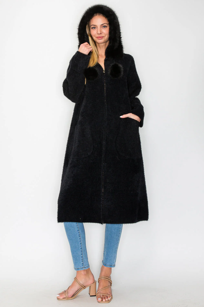 Suraya Knitted Brushed Coat in black with faux fur hood and pom-poms by JOH APPAREL