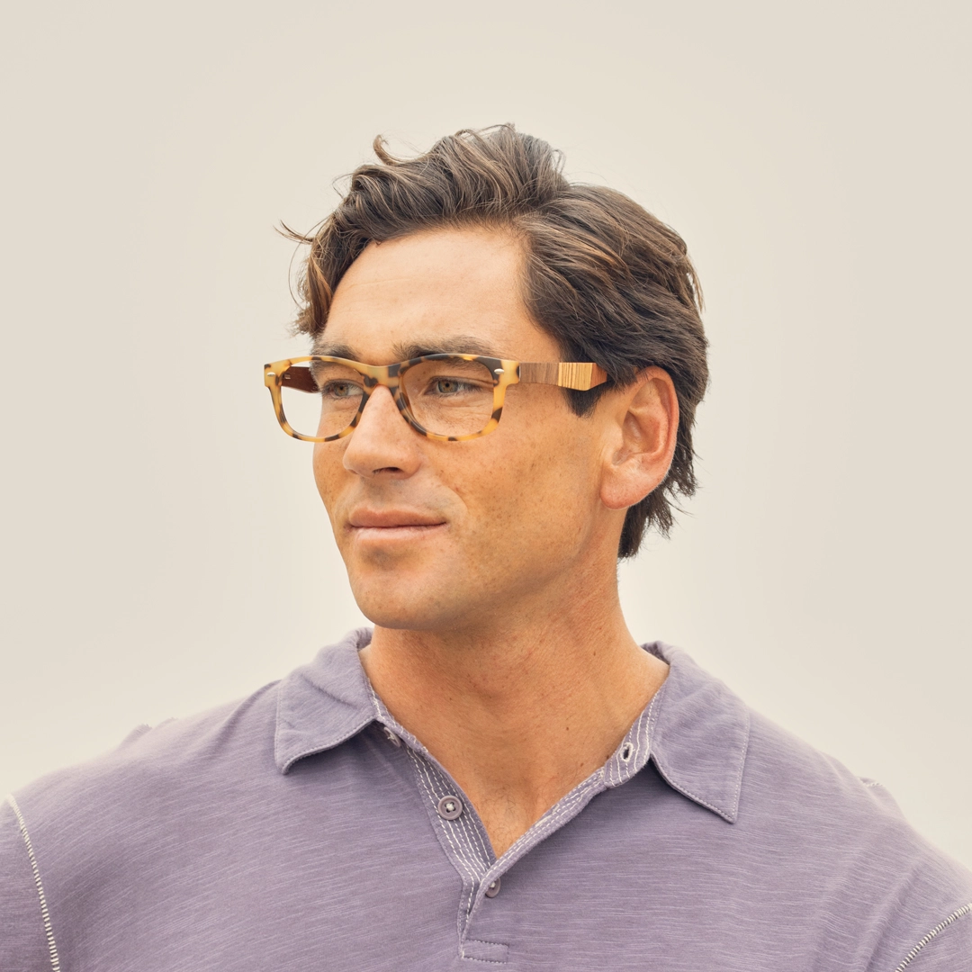 River eyeglasses on model, matte tort frame with wood-look temple detail