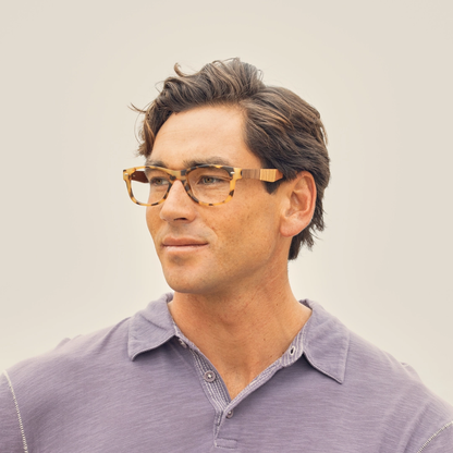 River eyeglasses on model, matte tort frame with wood-look temple detail