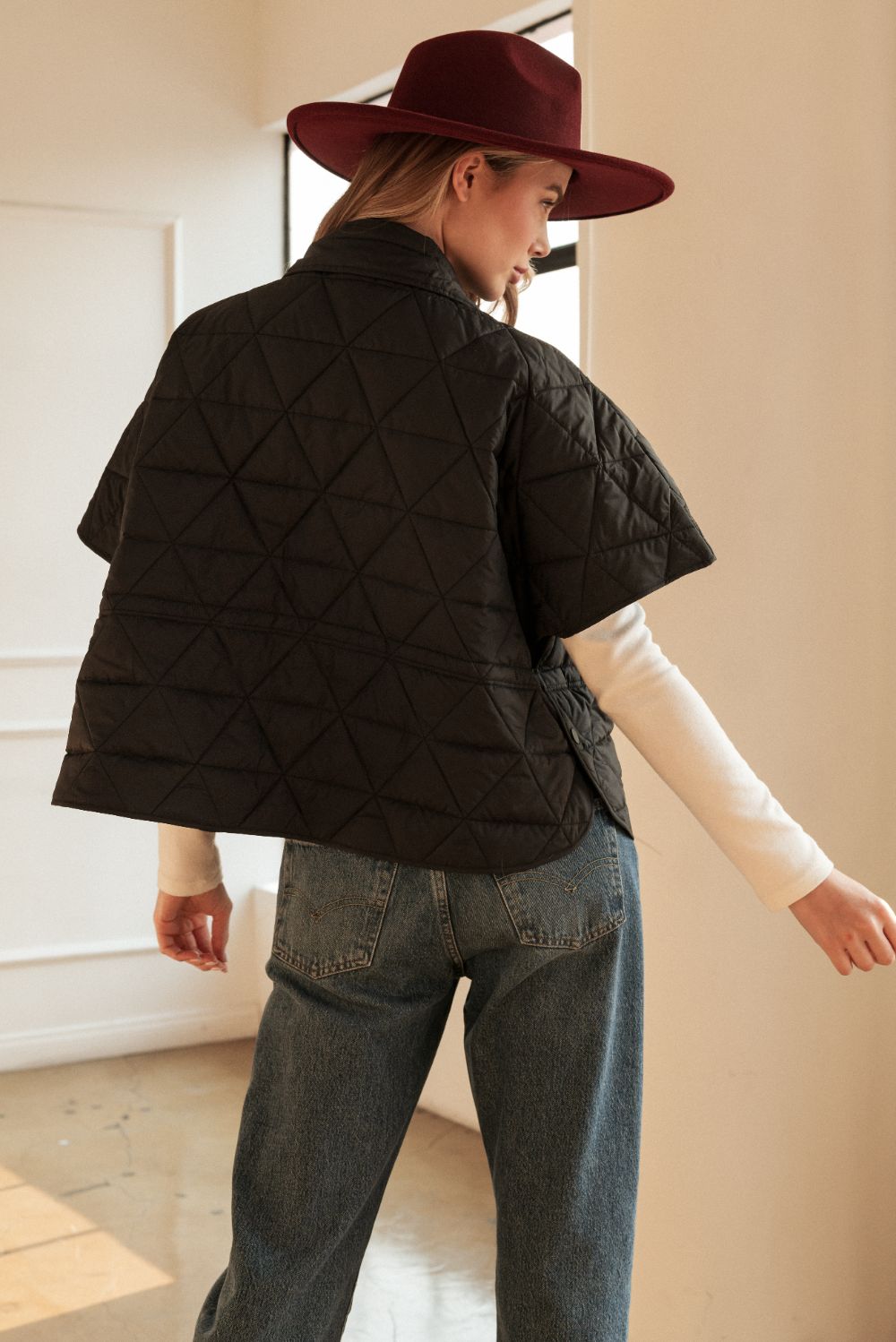 Jamel Puffer Jacket (BLACK) back view with diamond quilting and short sleeves