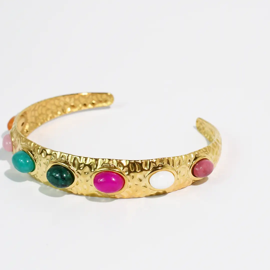 Paraiso Bangle with hammered gold cuff and multicolor oval gemstones from Treasure Jewels