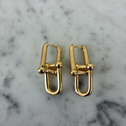 Gold U-link dangle earrings with square links and round bead accents