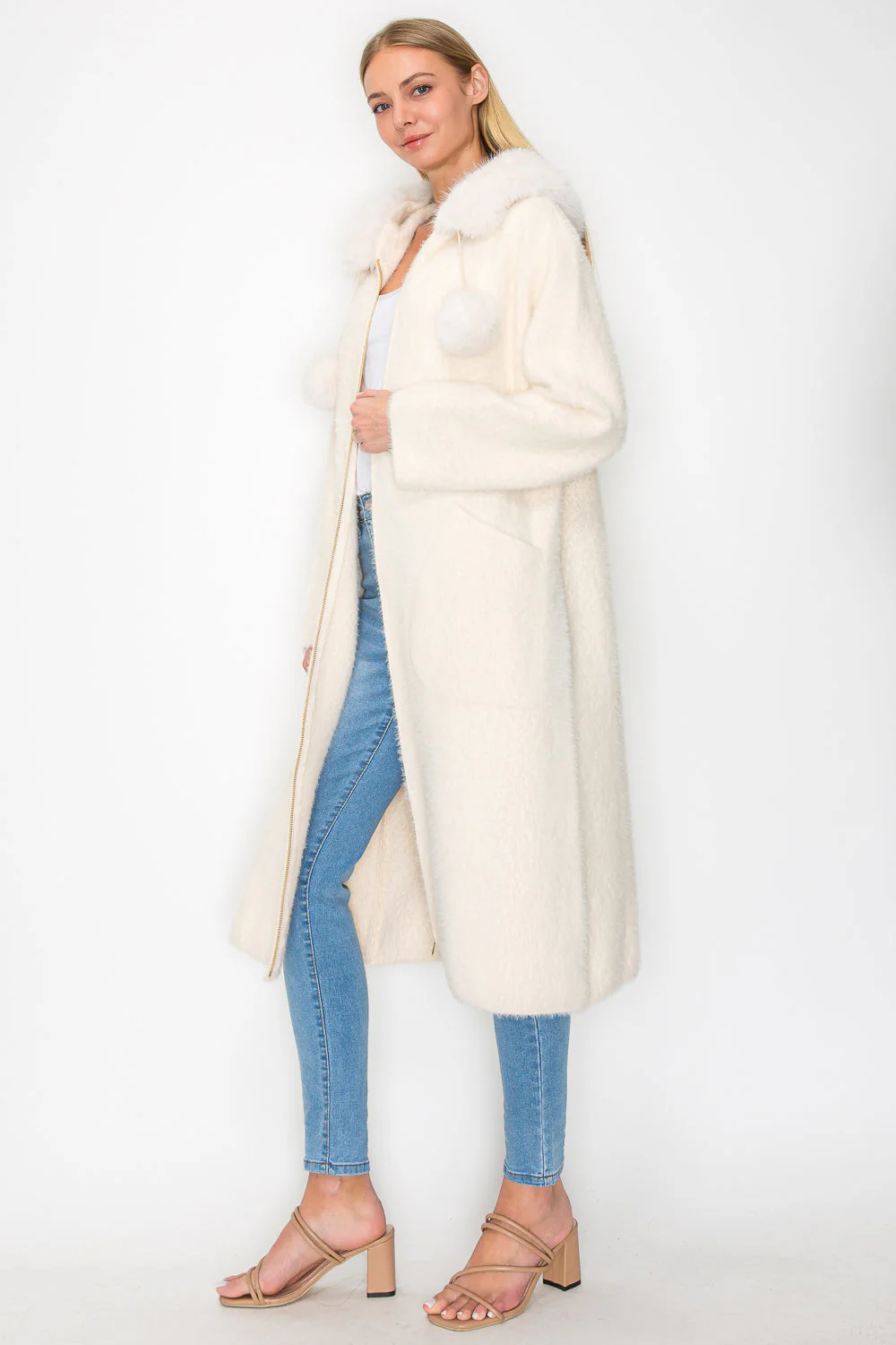 Suraya Knitted Brushed Coat in beige, white, and black with faux fur pom-poms by JOH APPAREL