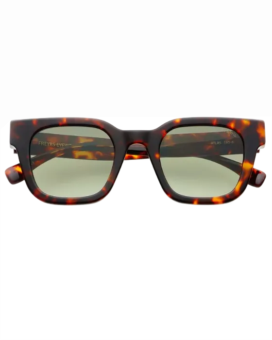 Tortoiseshell sunglasses with dark lenses on a white background