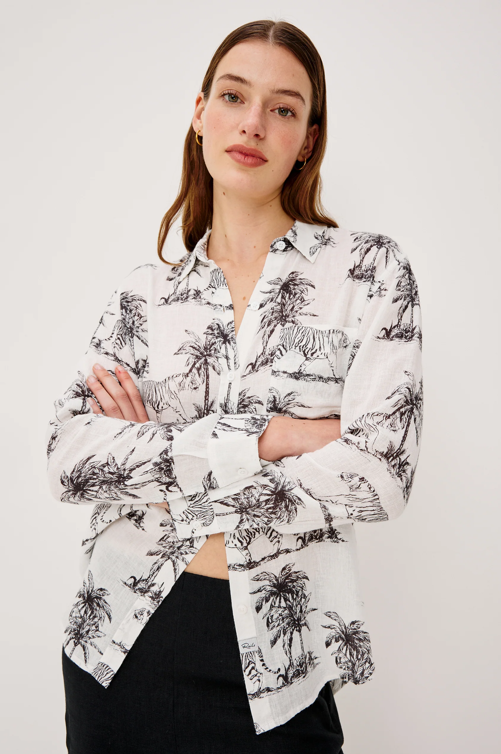 Woman wearing Charli - Ivory Bengal shirt in white linen blend with animal and palm prints by RAILS