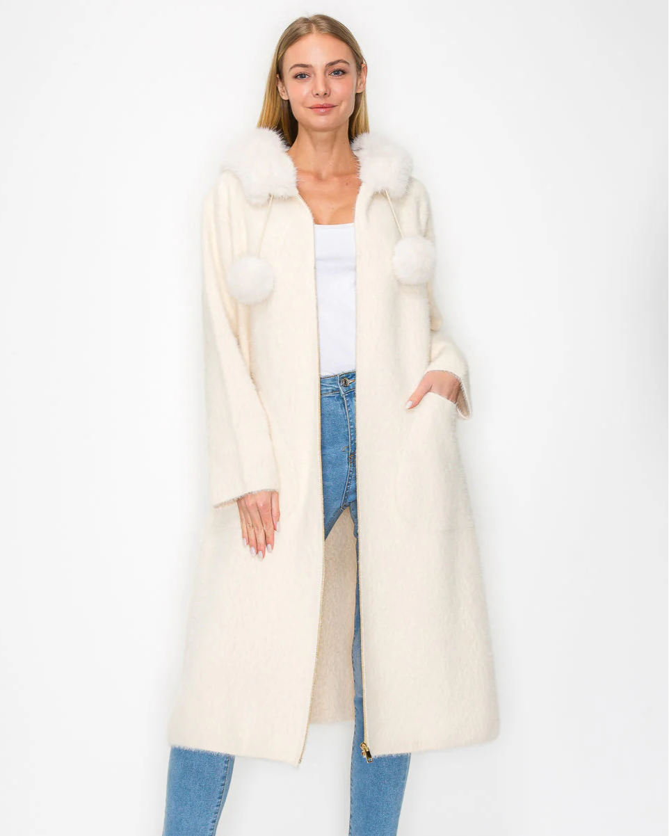 Suraya Knitted Brushed Coat in beige and white with faux fur hood and pom-poms by JOH APPAREL