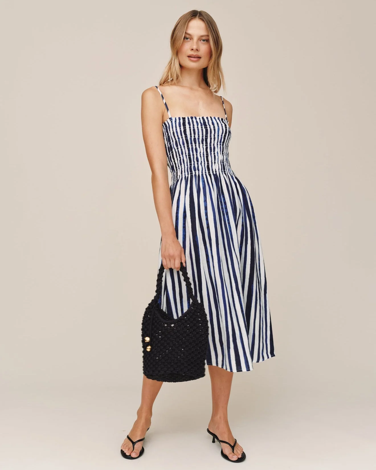 Smocked Midi Dress with navy and white stripes, fitted bust, flowing skirt by BELLA DAHL at HCO