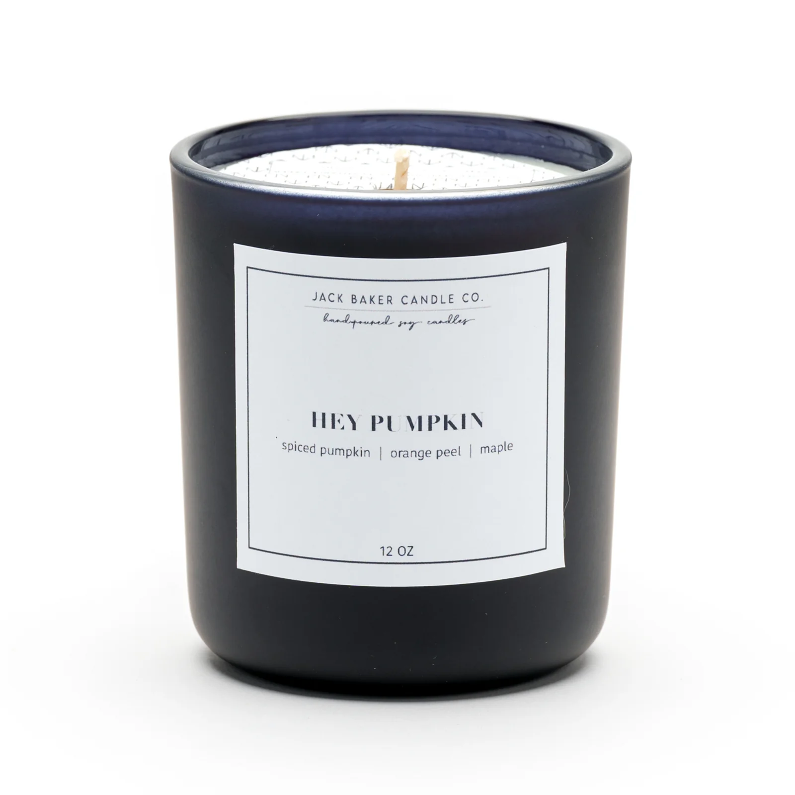 Hey Pumpkin Candle by Jack Baker Candle Co. in a sleek black container featuring spiced pumpkin, orange peel, and maple scents, perfect for a personally curated Hill Country style home fragrance.
