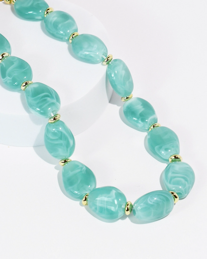 Aqua Muse Necklace with aqua marbled stones and gold beads by TREASURE JEWELS, curated in Fredericksburg TX