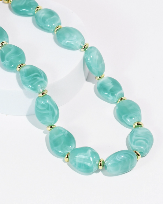 Aqua Muse Necklace with aqua marbled stones and gold beads by TREASURE JEWELS, curated in Fredericksburg TX