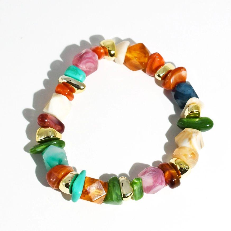 Color Twist Bracelet with vibrant orange, green, pink, and gold beads, personally curated Fredericksburg TX