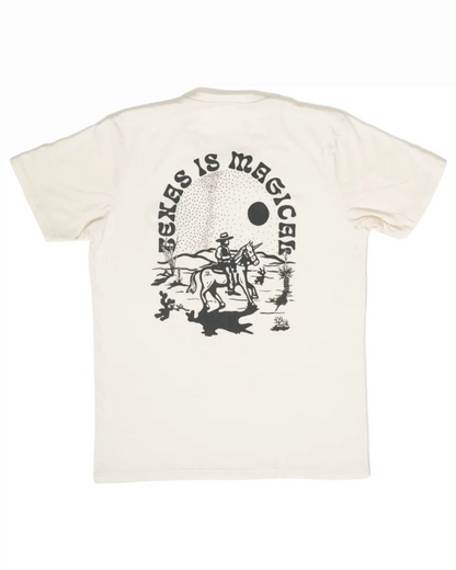 Off-white Texas Is Magical Tee featuring a black graphic of a cowboy on horseback in a desert landscape under a sun, blending Hill Country style with casual comfort.