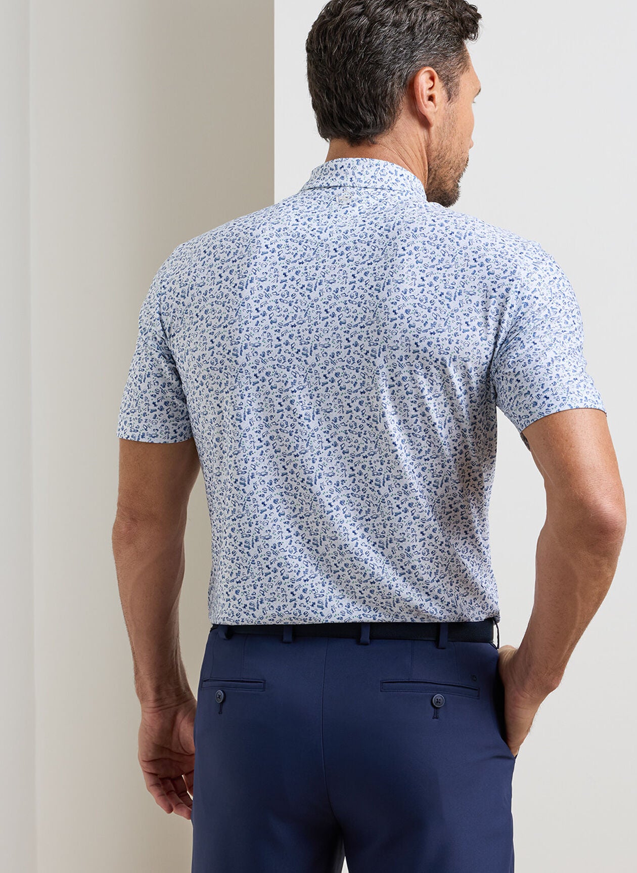 Wilkins Performance Jersey Polo in white floral blue with moisture wicking and UPF 50+ protection