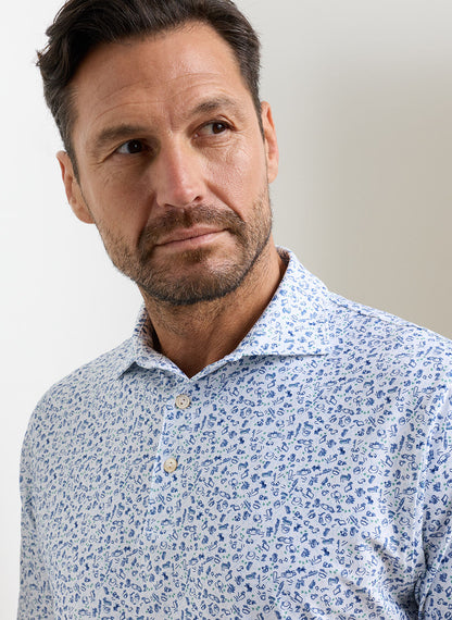 Wilkins Performance Jersey Polo in white floral blue with moisture wicking and UPF 50+ protection