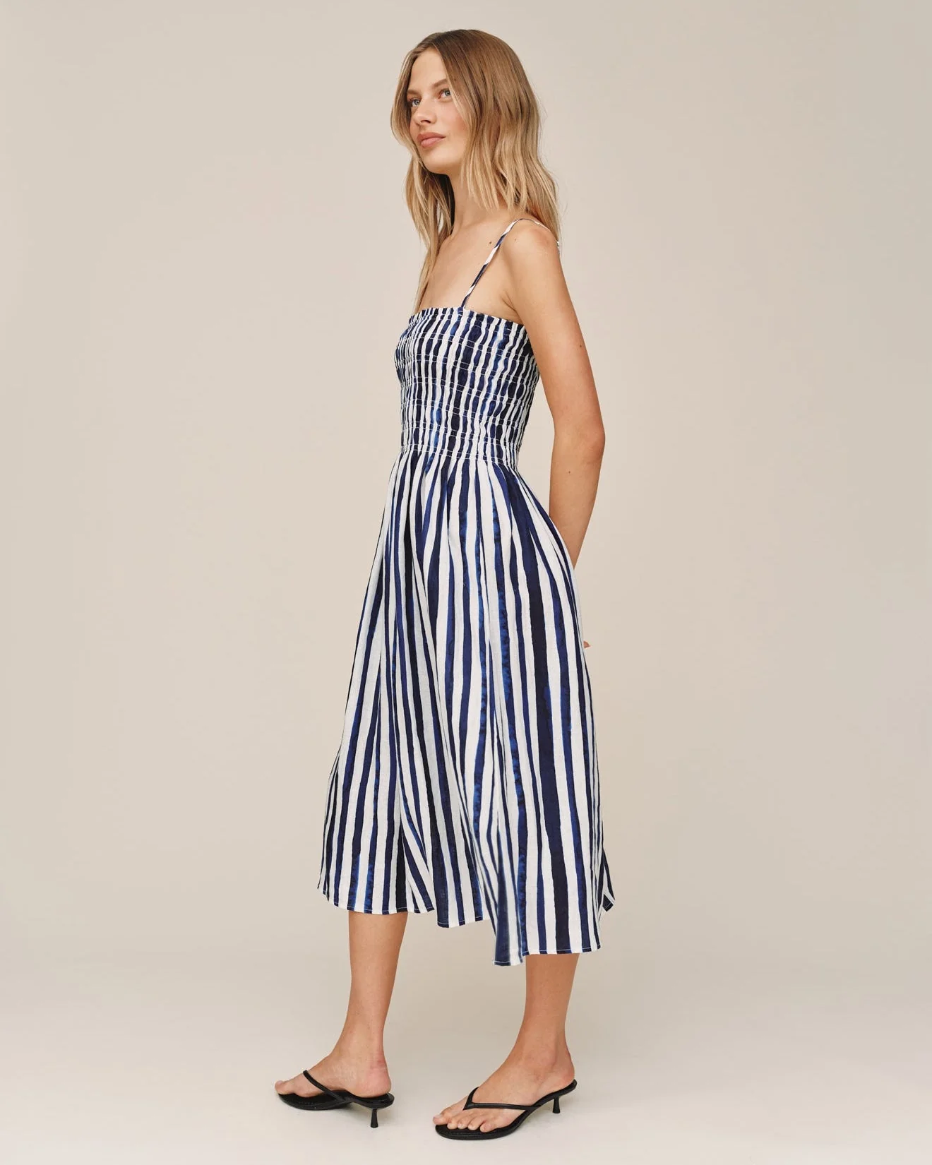 Smocked Midi Dress in blue and white stripes with fitted bust and flowing skirt by BELLA DAHL