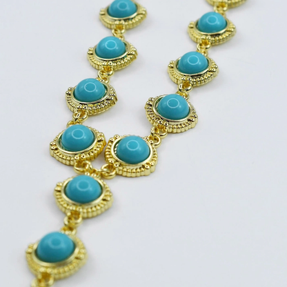 Turquoise Cascade Gold Necklace featuring vibrant turquoise stones in detailed gold settings, curated style