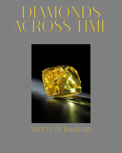 Cover of "Diamonds Across Time: Facets Of Mankind" book featuring a close-up of a polished yellow diamond reflecting light on a dark surface, personally curated in Fredericksburg, Texas.