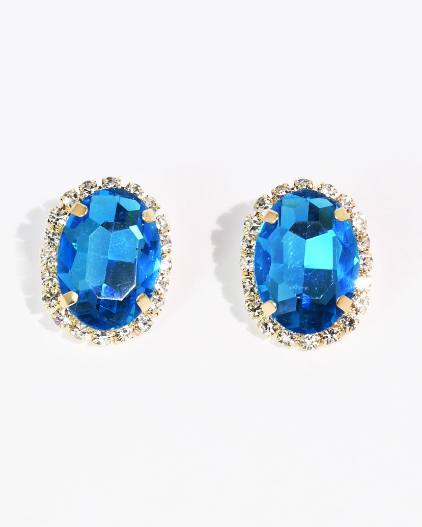 The Santorini Studs with luminous blue oval gemstones and crystal accents by TREASURE JEWELS