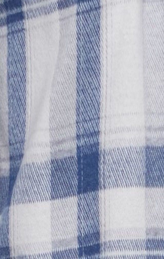 Cream and blue plaid knit flannel fabric close-up