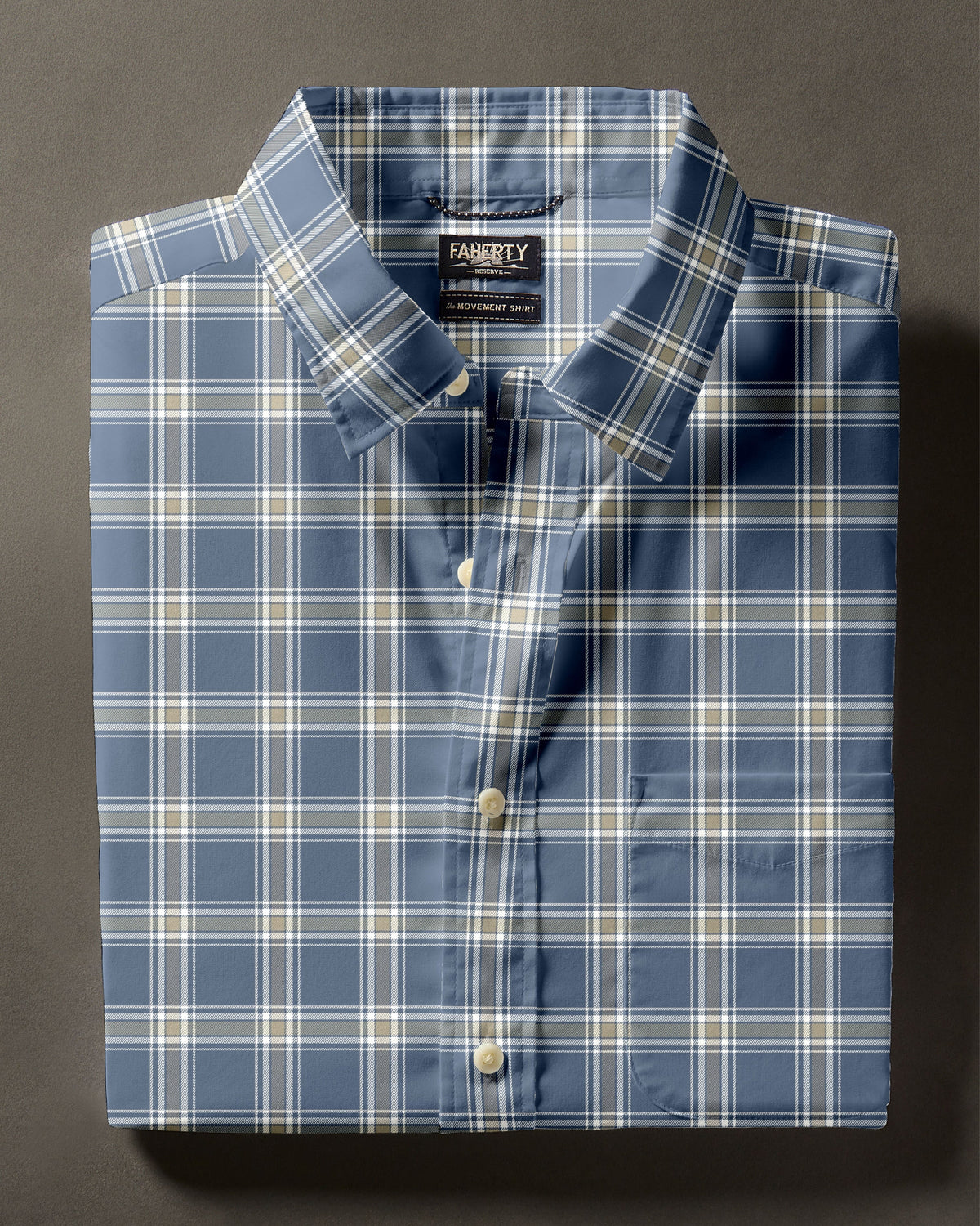 Folded blue and white plaid button-down shirt on a neutral background