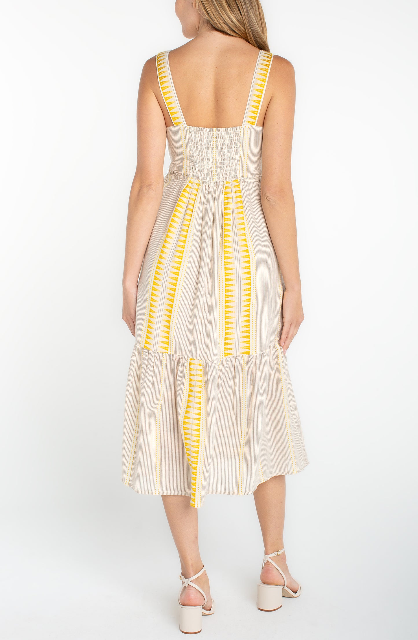 slvless midi dress with yellow geometric contrast, smocked back and flowing skirt panel