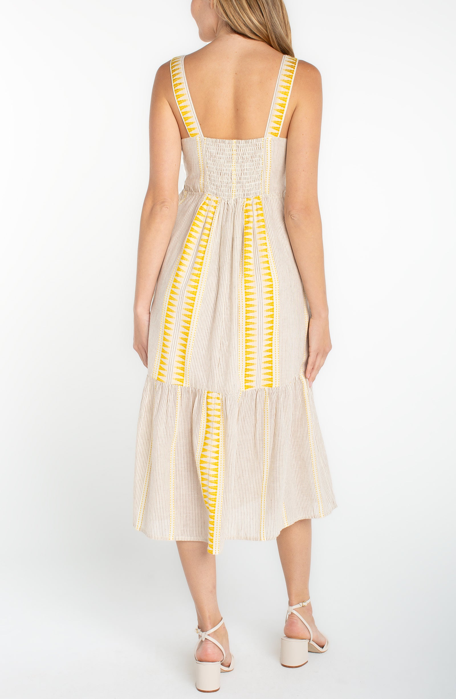 slvless midi dress with yellow geometric contrast, smocked back and flowing skirt panel