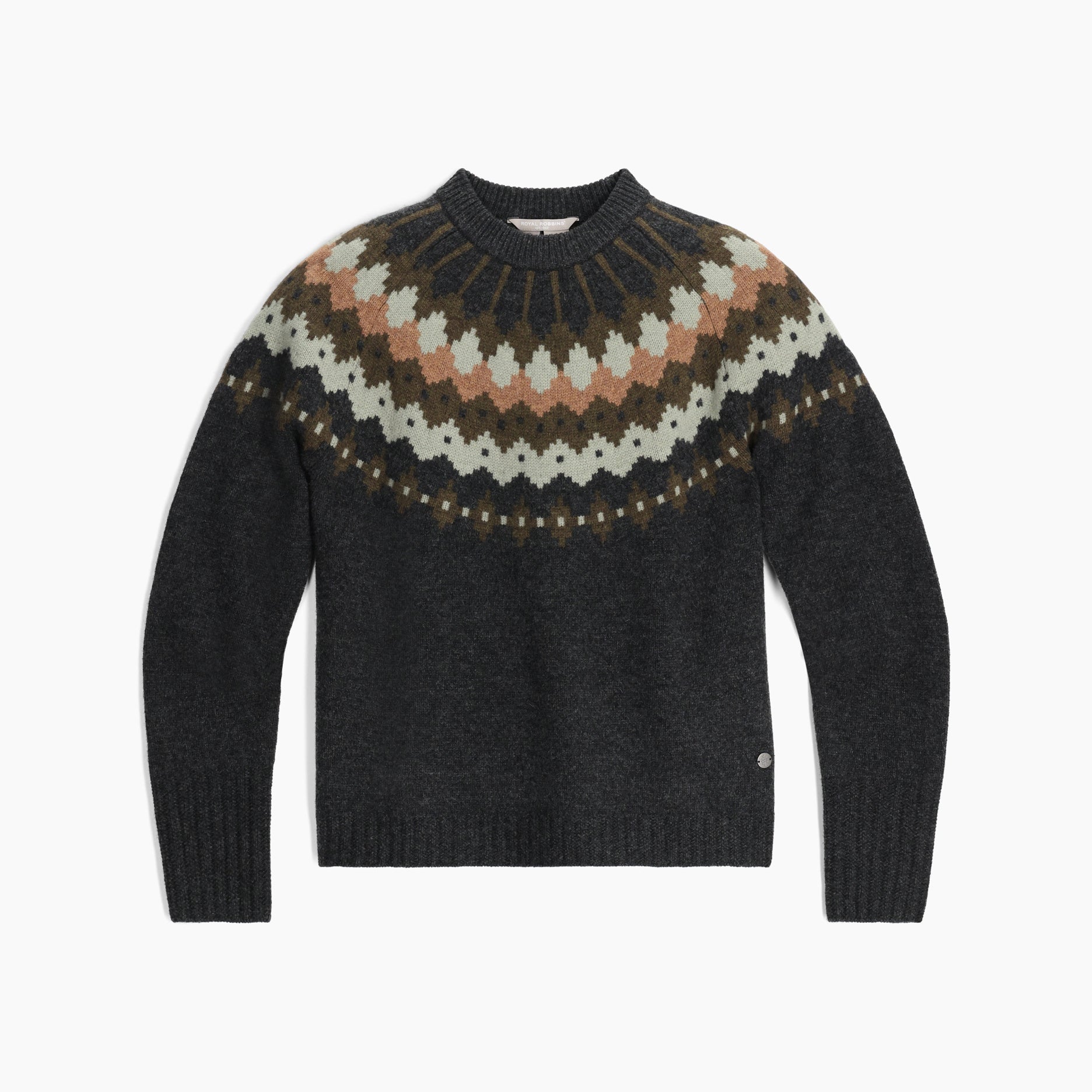 Woman wearing a beige sweater with a brown and rust geometric pattern
